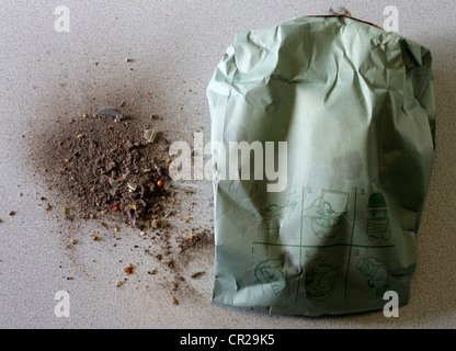 A hoover bag and some of its contents beside it Stock Photo