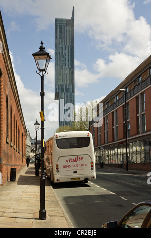 View of Beetham Tower Liverpool Road Manchester city centre with red brick  Manchester Museum of Science and Industry on  left Stock Photo