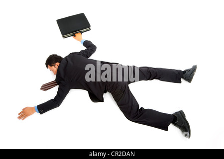 businessman lying down on the ground Stock Photo