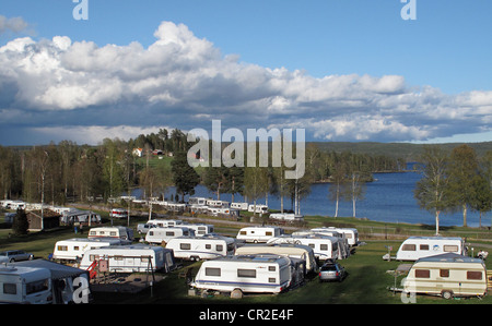 Travel trailers in Ekeby Camping site by Västra Silen lake, Årjäng, Värmland, Sweden Stock Photo
