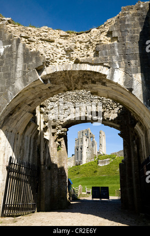 Corfe Castle keep / tower seen through the outer gatehouse entrance door. Dorset. UK. Stock Photo