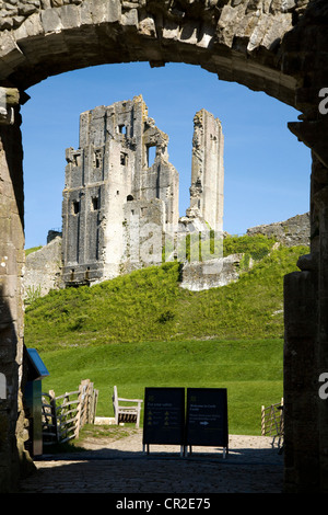 Corfe Castle keep / tower seen through the outer gatehouse entrance door. Dorset. UK. Stock Photo