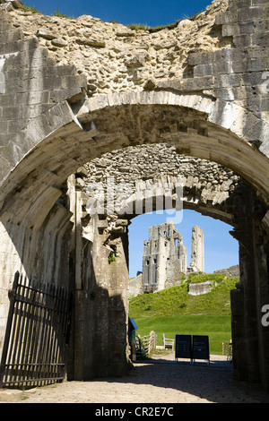 Corfe Castle keep / tower seen through the outer gatehouse entrance door. Dorset. UK. Stock Photo