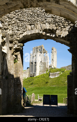 Corfe Castle keep / tower seen through the outer gatehouse entrance door. Dorset. UK. Stock Photo