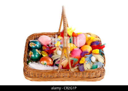 Easter decoration,Colored eggs in wicker basket Stock Photo