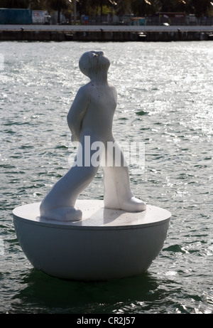White buoy shaped like a man in Port Vell, Barcelona Stock Photo
