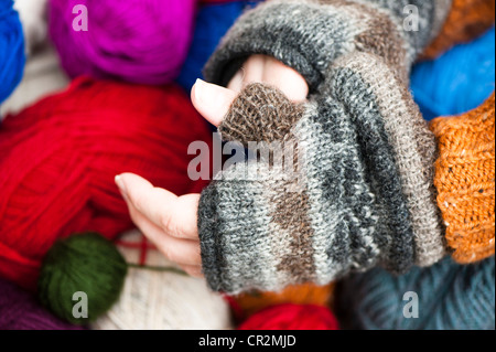 Man putting on fingerless gloves Stock Photo