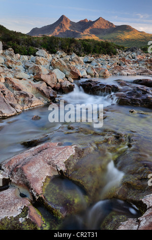 Allt Dearg Mor and the peaks of the Black Cuillin in evening summer sunshine, Isle of Skye Stock Photo