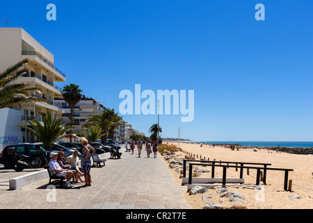 Beach and seafront promenade in Quarteira, Algarve, Portugal Stock Photo