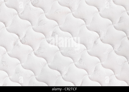 Background of soft comfortable quilted white mattress Stock Photo