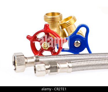 Blue and red plumbing valves with metal hoses Stock Photo