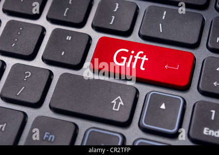 Gift concepts or buying a gift online, with a message on keyboard enter key. Stock Photo