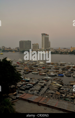 A central Cairo panorama looking east  and north across the Nile River at sunset. Stock Photo