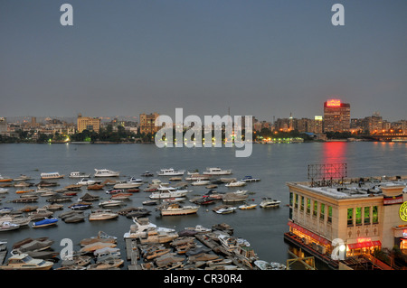 A central Cairo panorama looking east  and north across the Nile River at sunset. Stock Photo