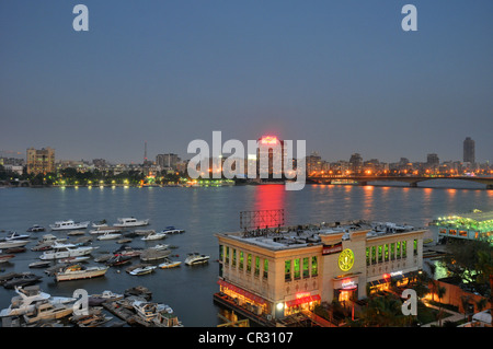 A central Cairo panorama looking east  and north across the Nile River at sunset. Stock Photo