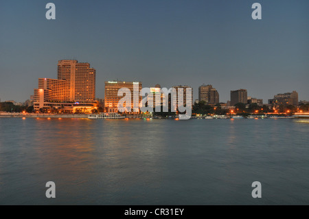 A central Cairo panorama looking east across the Nile River at sunset. Stock Photo