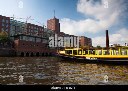 Barges opposite the Speicherstadt historic warehouse district in the inland port, Hamburg, Germany, Europe Stock Photo