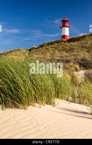 Red and white striped lighthouse of List Ost on the Sylt peninsula of Ellenbogen, viewed from the beach, List, Sylt Stock Photo