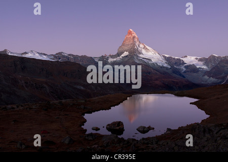 Mt Matterhorn is reflected in Stellisee Lake before sunset, Zermatt, Canton Valais, Switzerland, Europe, PublicGround Stock Photo