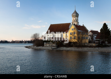 Catholic Church of St. George on Lake Constance in winter, in the evening light, Wasserburg, district of Lindau, Bavaria Stock Photo