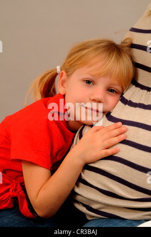 Little girl, 5 years, with her pregnant mother Stock Photo