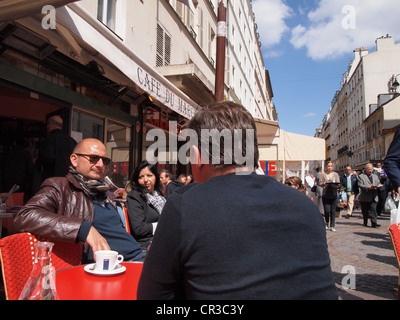 People enjoying cafe at a bistro on Rue Cler in Paris, France, May 13, 2012, © Katharine Andriotis