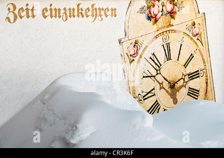 Painted clock, lettering "Zeit einzukehren", German for "time to stop by at our restaurant", Todtnauer Huette mountain inn on Stock Photo