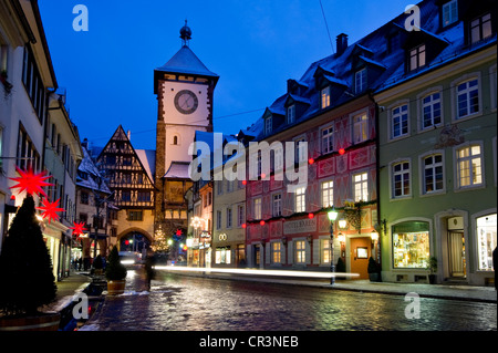 Schwabentor gate tower and Christmassy and snowy old town of Freiburg im Breisgau, Black Forest, Baden-Wuerttemberg Stock Photo