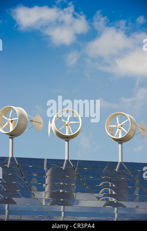 Small wind turbines and solar panels on the roof of a hotel, Freiburg im Breisgau, Baden-Wuerttemberg, Germany, Europe Stock Photo