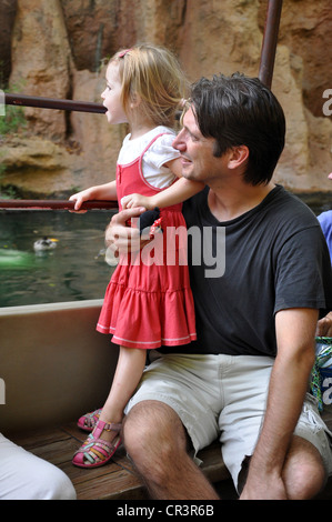 Father and daughter enjoy ride on Tramp Steamer through Disneyland's 'Jungle River Cruise' in Anaheim, California Stock Photo