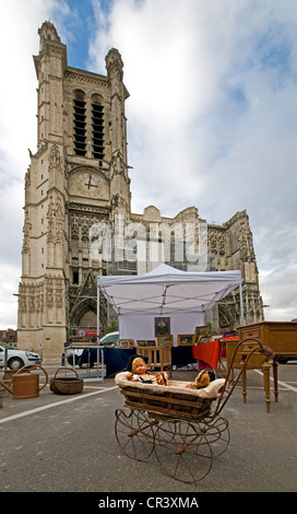 Troyes Cathedral France antique dolls pram market foreground Roman Catholic cathedral “Cathédrale Saint-Pierre-et-Saint-Paul' Stock Photo