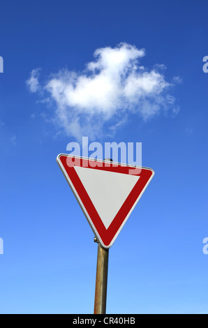 Traffic sign, give way, against a blue sky with clouds, Germany, Europe Stock Photo