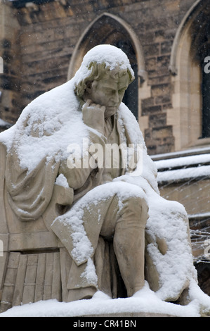 Snow covered statue of Dr Johnson in the Market Square Lichfield in front of his house Stock Photo