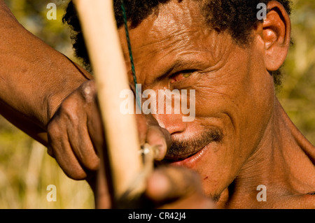 Bushman, San, with bow and arrow, near Andriesvale, Kalahari Desert, Northern Cape, South Africa, Africa Stock Photo