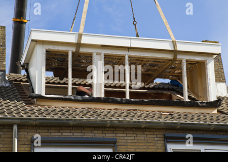 Placing the new dormer-windows exactly right on the roof Stock Photo