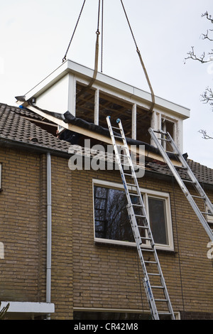 Placing new and bigger dormer-window on front side of house Stock Photo