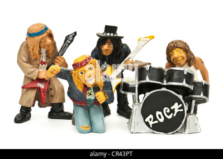 Miniature rock band with two guitarists, drummer and lead singer Stock Photo
