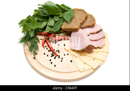 Sandwich ingridients with greens on cutting board isolated on white background Stock Photo