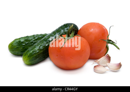 Fresh tomatoes, cucumbers and garlic isolated on white Stock Photo