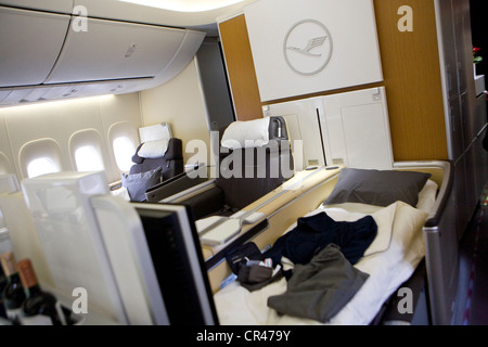 First class seats inside a Boeing 747-8 jumbo jet airplane from the ...