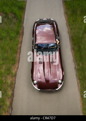 Jaguar E-Type, 1966 model, classic car, driving on a narrow asphalt road during an outing, Bad Homburg, Hesse, Germany, Europe Stock Photo
