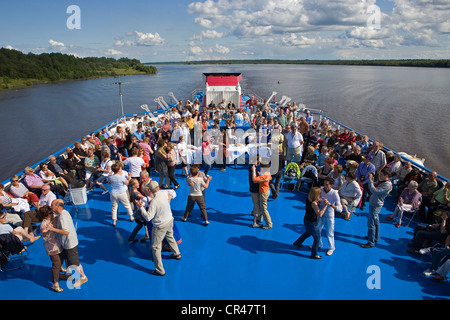 Russia, trip between Goritsy and Kiji island, dancing to celebrate the tea ceremony on the upper deck of Leonid Sobolev cruise Stock Photo