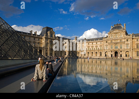France, Paris, Louvre pyramid by architect IM Pei and facades of the Richelieu wing and the Cour Napoleon of the Musee du Louvre Stock Photo