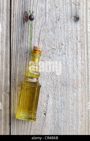 Vintage bottle hanging on the wooden wall Stock Photo