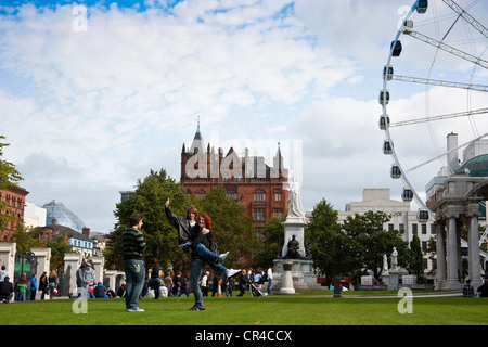 Teens posing in front of City Hall, Belfast, Northern Ireland, United Kingdom, Europe Stock Photo