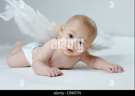 Little baby wearing angel wings, desire to have children Stock Photo