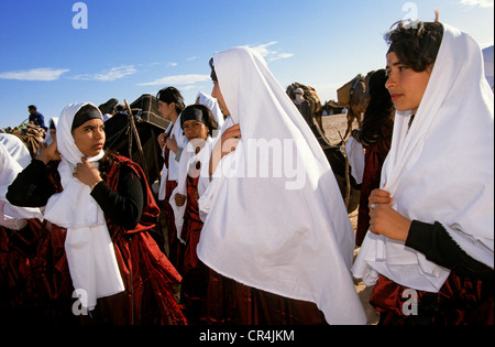 Tunisia, Kebili Governorate, Douz, Desert Festival, parade of women with traditional outfits Stock Photo