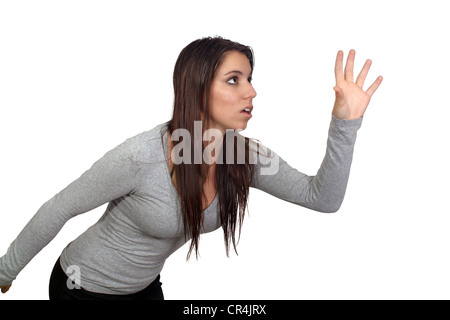 Attractive Brunette Reaching or Grabbing (1) Stock Photo