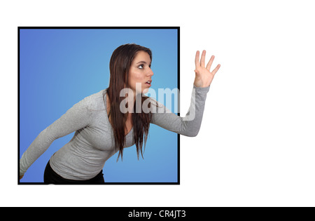 Attractive Brunette Reaching or Grabbing (2) Stock Photo