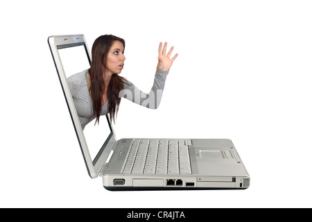 Attractive Brunette Reaching From a Laptop (1) Stock Photo